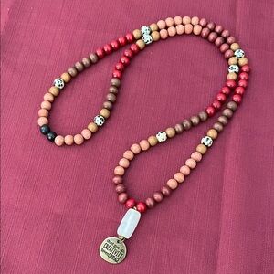 Hand assembled beaded necklace courage.